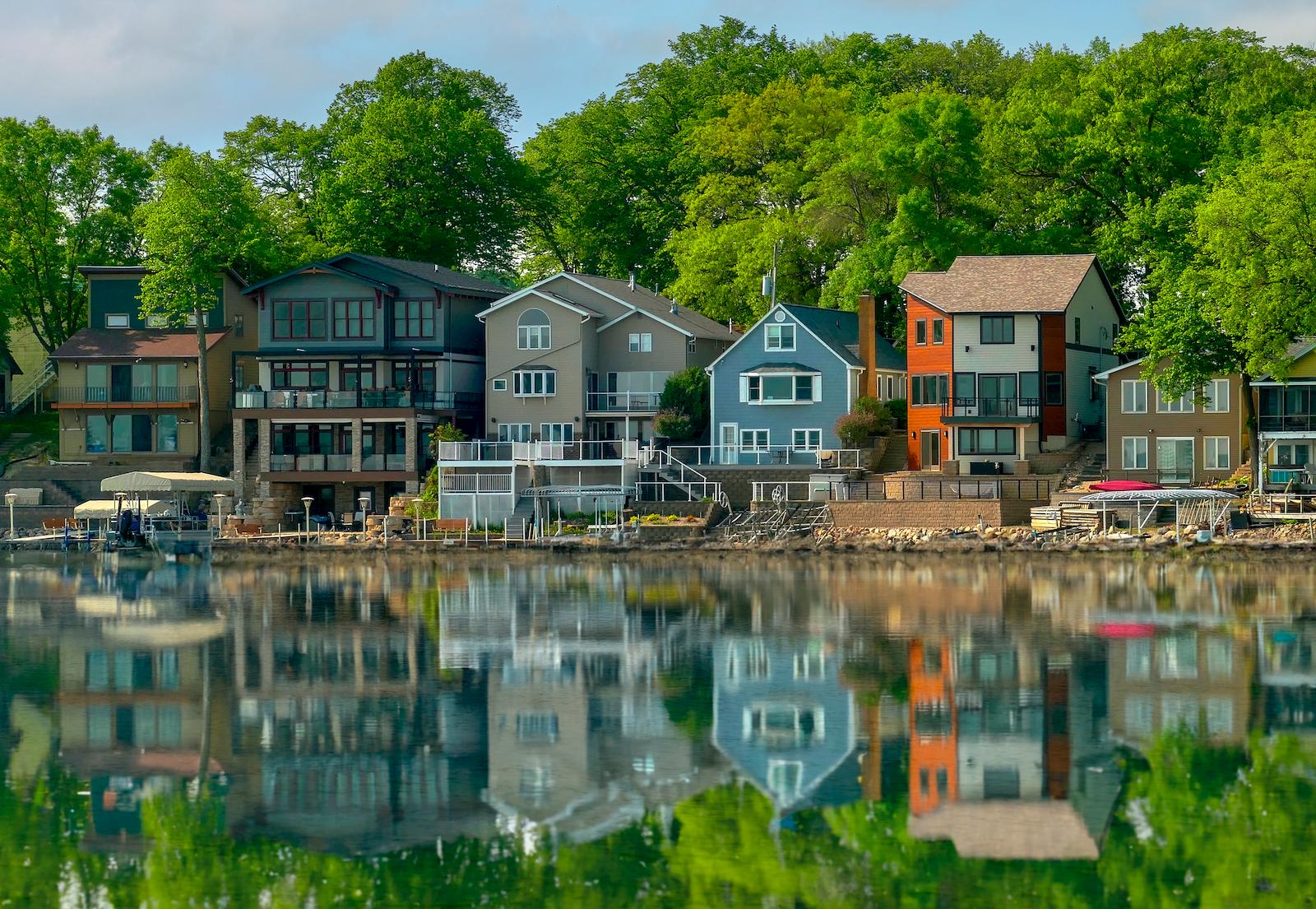 Lake houses reflecting in a mirror lake
